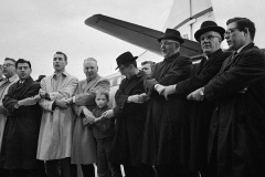 Rabbi Richard A. Hirsch, second from left, and a group of clergymen from the Washington area join hands to sing “We Shall Overcome” at Washington National Airport on March 8, 1965 before flying to Alabama to take part in a scheduled march on March 9 for Negro voting rights.