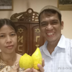 Comparing a locally grown etrog (left) with Israeli imports in Indonesia.